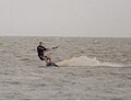 Kiteboarder edging his board