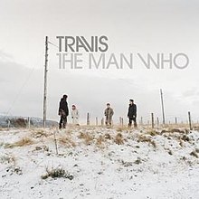 Four men standing in a snowy field