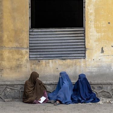 Afghan women wait to receive food rations distributed by a humanitarian aid group, Kabul, Afghanistan, May 23, 2023. 