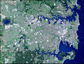 This simulated true-color Advanced Spaceborne Thermal Emission and Reflection Radiometer (ASTER) image shows the Sydney metropolitan area on October 12, 2001, and covers an area of 42 by 33 kilometers. The image displays the concentrated development of the urban area.