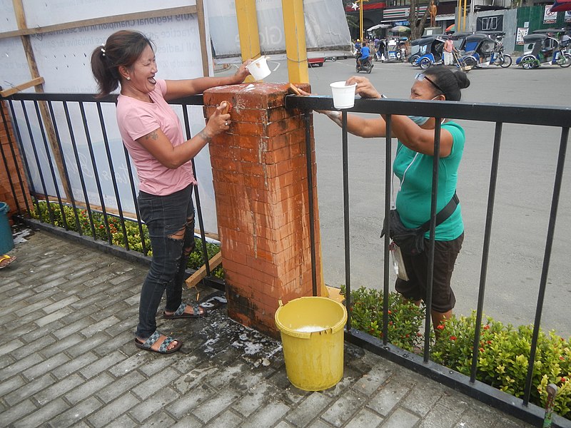 File:0103Sanitation workers cleaning clay brick fences Baliuag Glorietta Park 58.jpg