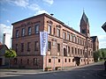 Sandsteinbau der ehemaligen Schule in „Neu-Wörth“ (heute Rathaus)