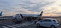 airport vehicles beneath a Bombardier CRJ900 of Lufthansa (walkboarding)