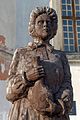 Wooden sculpture of Marie Skłodowska Curie in Szydłów