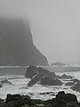 Cliffs of Vágseiði in foggy weather.