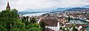 city, lake and mountains view from the tower