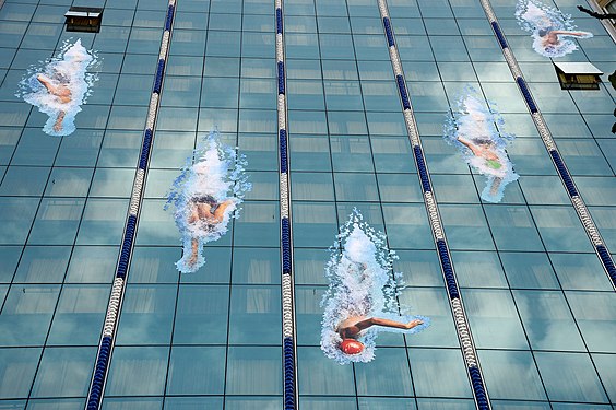 swimmers on facade of a building (2016)