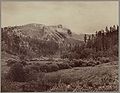 "Harney's Peak." Just after a storm. Part of Peak cut off by vaper [sic] but the statuary man in plain view. Photo from west side (1890, LC-DIG-ppmsc-02654)