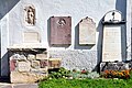 English: Gravestones on the west wall rigt of the church portal Deutsch: Grabsteine an der Westwand rechts vom Kircheneingang