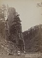 Grabill's photography wagon and horse parked in front of Castle Rock.