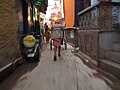 Man with pushcart in the old city of Varanasi.