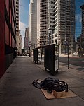 Thumbnail for File:Homelessness in Downtown Los Angeles, where an unhoused person sleeps on the sidewalk.jpg