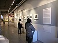 "Visitors_Viewing_a_Photography_Exhibition_at_The_GLBT_History_Museum_(San_Francisco)..jpg" by User:GKoskovich