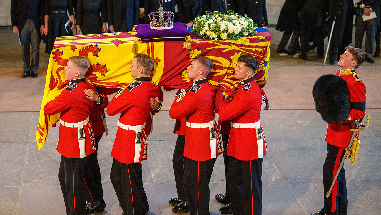 The coffin of Queen Elizabeth II is carried into The Palace of Westminster by guardsmen from The Queen's Company, 1st Battalion Grenadier Guards during the procession for the Lying-in State of Queen Elizabeth II on September 14, 2022 in London, England.