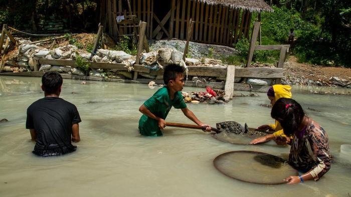 Children pan for gold