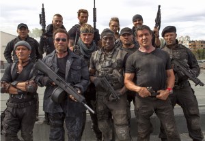 THE EXPENDABLES 3, from left: Jet LI, Antonio Banderas, Glen Powell, Arnold Schwarzenegger, Kellan Lutz, Dolph Lundgren, Wesley Snipes, Ronda Rousey, Randy Couture, Victor Ortiz, Sylvester Stallone, Jason Statham, on set, 2014. ph: Phil Bray/©Lionsgate/courtesy Everett Collection