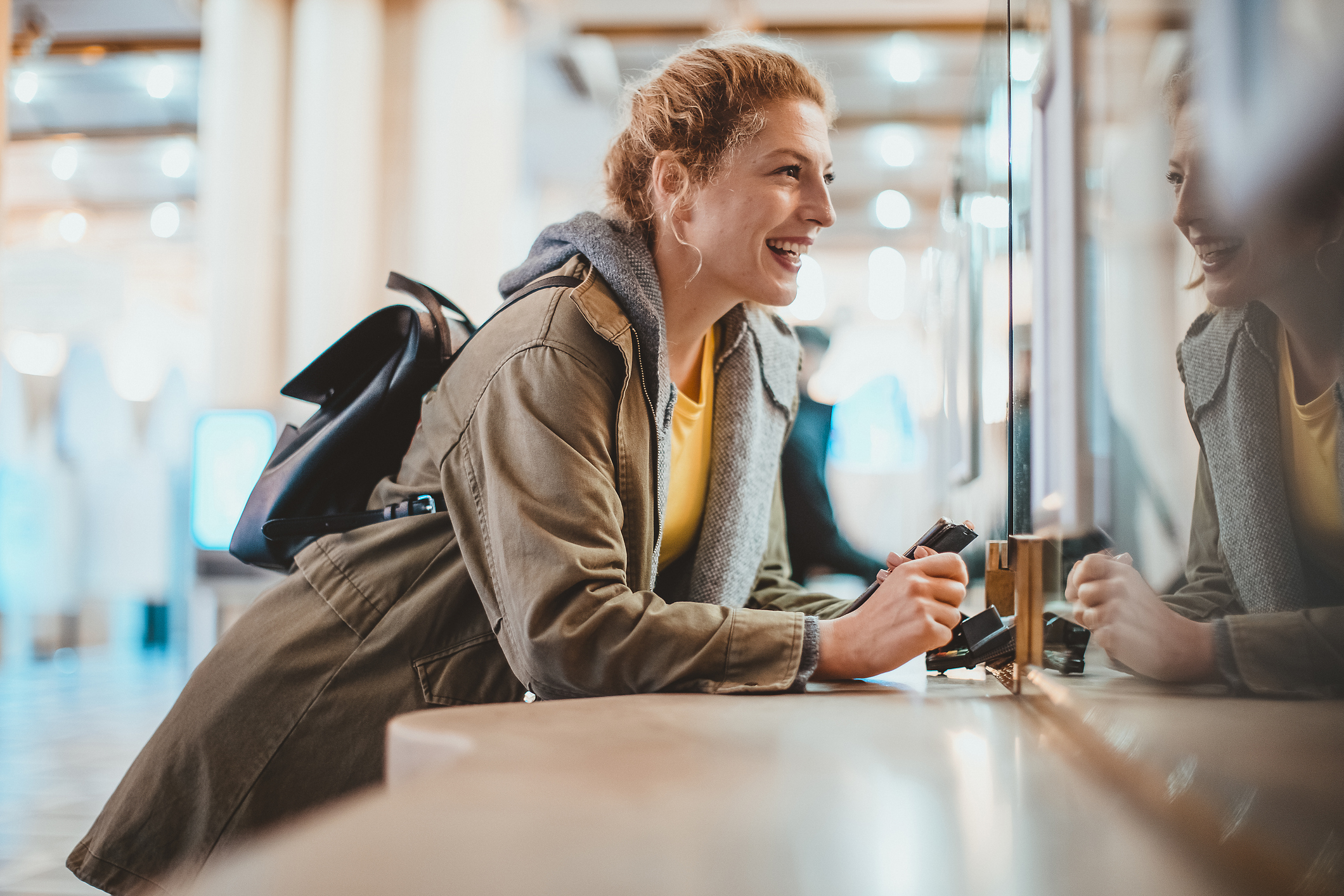 Woman looking at her travel money options before going abroad