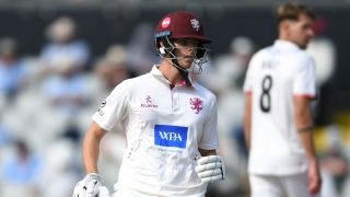 Vaughan struck a fluent 68 but Somerset, with four wickets remaining, need 189 runs to win at Old Trafford