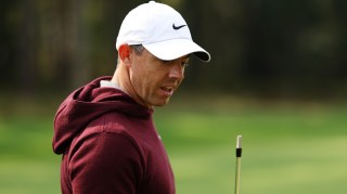 McIlroy inspects the damage after his nine-iron snapped