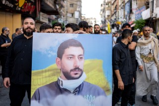 A funeral procession took place on Wednesday for one of the people who died in the explosions in a southern suburb of Beirut this week