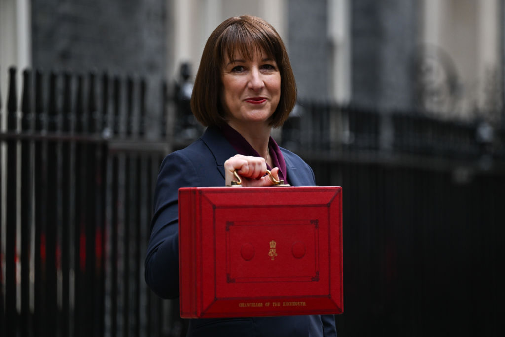 Rachel Reeves, UK chancellor of the exchequer, smiles and holds aloft a red dispatch box outside 11 Downing Street ahead of presenting her budget to parliament in London, UK, on Wednesday, Oct. 30, 2024.