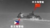 (FILE) A Philippine coast guard vessel and a Chinese coast guard vessel sail next to each other during an incident in the South China Sea, August 19, 2024. 