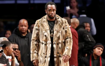 Sean "Diddy" Combs walks down the sideline during the second half of an NBA basketball game between the Brooklyn Nets and the New York Knicks in New York on March 12, 2017. (Kathy Willens/AP Photo)