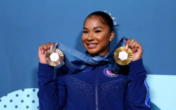 Jordan Chiles of United States celebrates with her medals at the 2024 Paris Olympics in Paris on Aug. 5, 2024. (Hannah Mckay/Reuters)