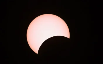 The moon partially covers the sun during an annular solar eclipse as seen from Mandalay in Burma on June 21, 2020. (Ye Aung Thu/AFP via Getty Images)