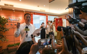 Hsu Ching-kuang (L), head of Taiwanese company Gold Apollo, speaks to the media outside the company's office in New Taipei City on Sept. 18, 2024. (Yan Zhao/AFP via Getty Images)