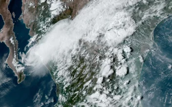 Tropical Storm Ileana (L) near the coastal Mexican city of Topolobampo on the eastern side of the Gulf of California at 6:10 p.m. ET on Sept. 14, 2024. (NOAA via AP)