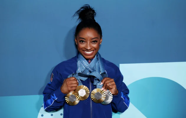 Simone Biles of Team United States poses with her Paris 2024 Olympic medals following the Artistic Gymnastics Women's Floor Exercise Final on day ten of the Olympic Games Paris 2024 at Bercy Arena in Paris, France, on Aug. 5, 2024. (Naomi Baker/Getty Images)