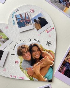 a heart shaped photo frame with pictures and words on it