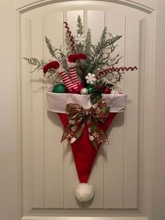 a christmas decoration hanging on the front door