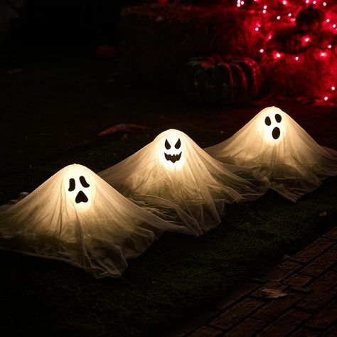 PRICES MAY VARY. Great Value Package: Our package includes 3 pieces of glowing white ghost path stakes, and stakes for fixing the little white ghosts in the ground for outdoor lawn use, the size of the little white ghost is 15inch. Glowing white ghost pathway light stakes turn your outdoor space into a creepy spectacle, creating a frightening atmosphere for Halloween night. Eye-Catching Design: Each stake features a white ghost yard stake and can light up, adding an eerie glow to your lawn or ga Halloween Hanging Ghost, Haunted House Decorations, Halloween Ghost Decorations, Lights Decor, Halloween Witch Decorations, Decoration Lights, Adornos Halloween, White Ghost, Halloween Garden