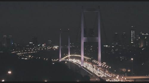 A bit of a Don Juan with his styled hair and single earring, FIKRET (17) illegally sells roses in the traffic jam on the Bosphorus Bridge. At the same time, he looks for a regular job as a shop assistant in the old downtown of Istanbul. UMUT (28) drives a