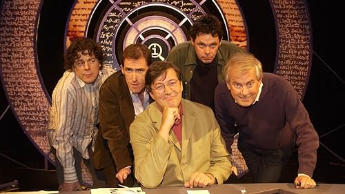 Stephen Fry, Rob Brydon, Alan Davies, Rich Hall, and Gyles Brandreth in QI (2003)