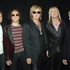 Joe Elliott, Vivian Campbell, Rick Allen, Rick Savage, Phil Collen, and Def Leppard