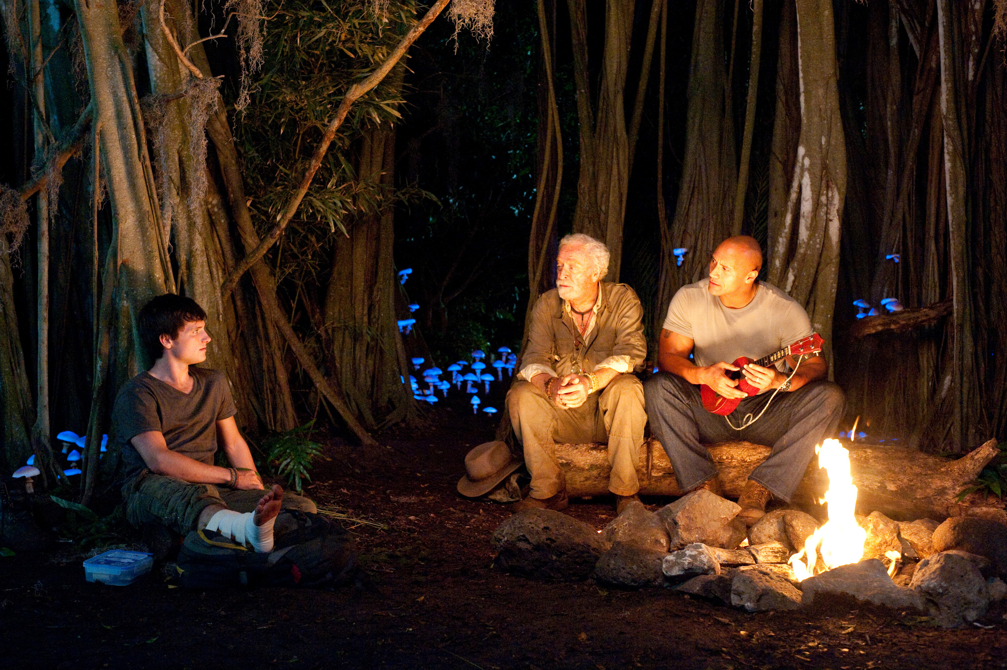 Michael Caine, Dwayne Johnson, and Josh Hutcherson in Hòn Đảo Huyền Bí (2012)