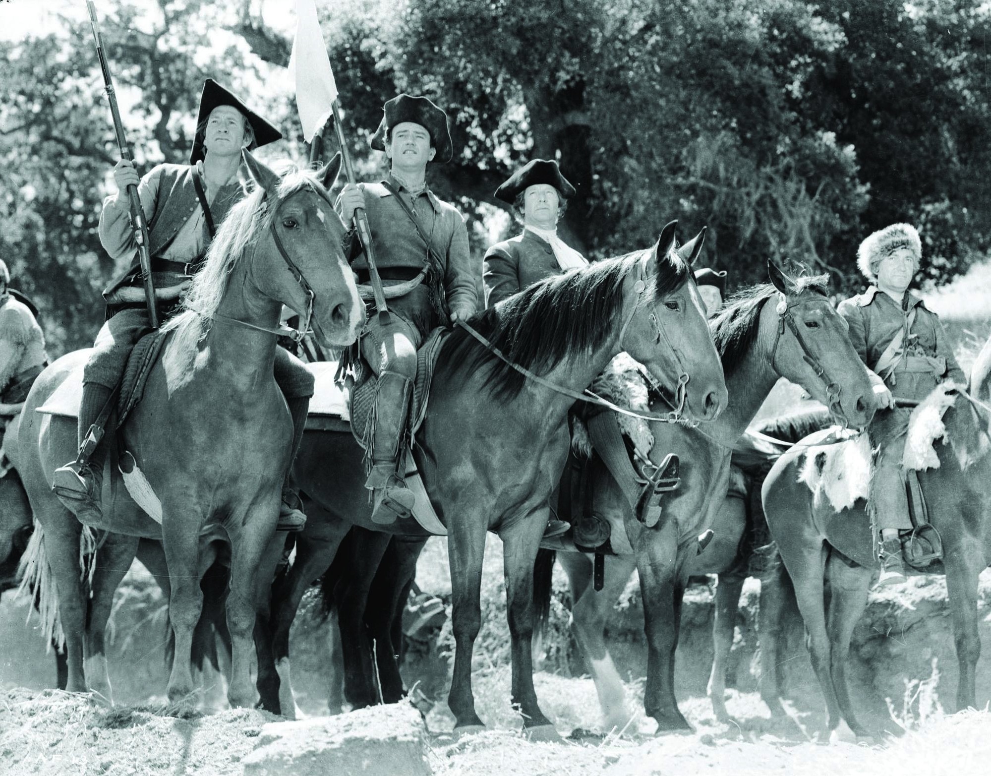 John Wayne, Robert Barrat, Wilfrid Lawson, and Chill Wills in Allegheny Uprising (1939)