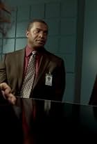 Roger Cross and Thandiwe Newton in Rogue (2013)