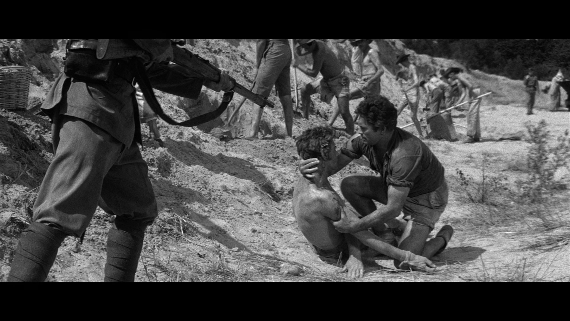 Carl Möhner in The Camp on Blood Island (1958)