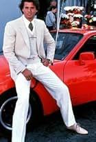 LORENZO LAMAS ON THE SET OF FALCON CREST WITH HIS PORSCHE 944 / 1983