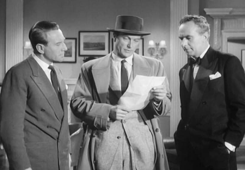 Richard Denning, Ronald Leigh-Hunt, and Hugh Moxey in Assignment Redhead (1956)