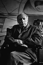 Pablo Picasso sitting in his studio, circa 1950. Modern silver gelatin, 14x11. $600 © 1978 Sanfrod Roth / LACMA MPTV