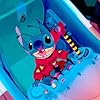 Stitch, an out-of-control genetic experiment from another galaxy, escapes from captivity and commandeers a police cruiser.