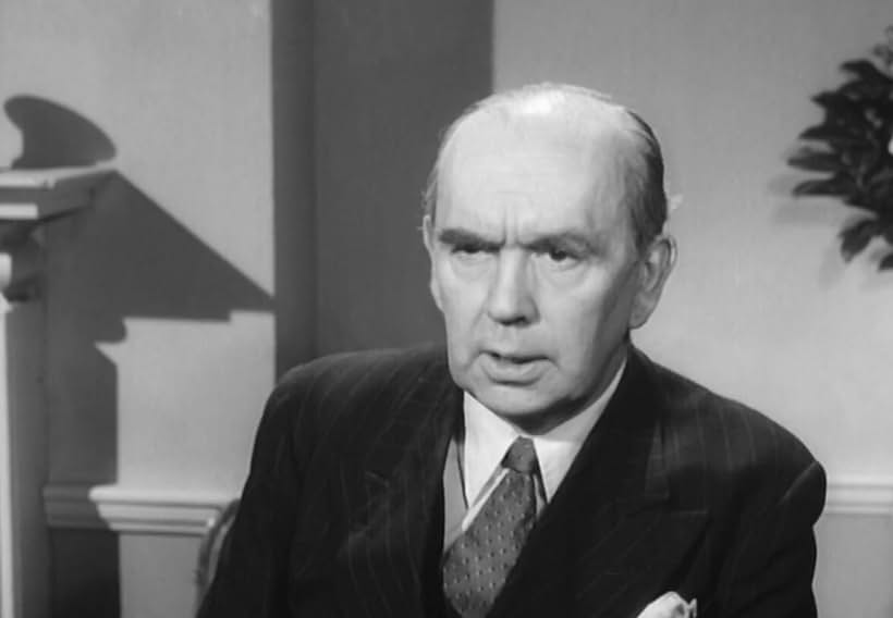 Ronald Adam in Assignment Redhead (1956)