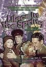 Errol Flynn, David Farrar, Kathleen Harrison, and Anna Neagle in Lilacs in the Spring (1954)