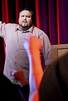 Michael McIntyre as "Jeremiah South" leads a "Restore America" rally in a scene from "The Messenger"