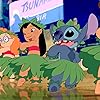 Daveigh Chase, Chris Sanders, and Miranda Paige Walls in Lilo & Stitch (2002)